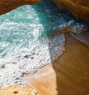 a view of the ocean from a cave