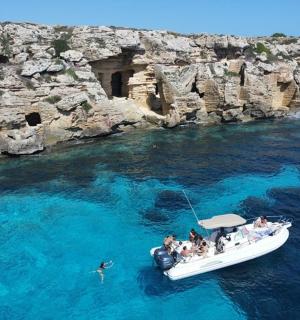 a group of people on a boat in the water