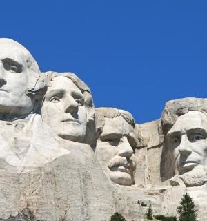 a stone wall with presidents faces on it
