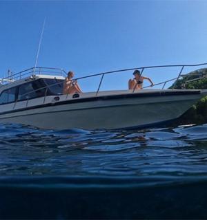 a group of people on a boat in the water