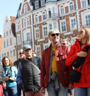 a group of people walking down a street