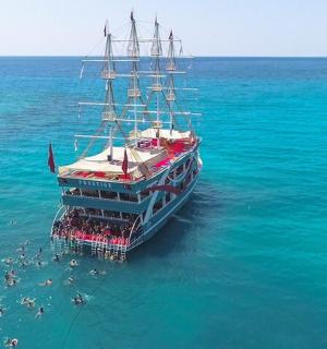a large boat in the water with people on it