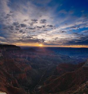 a view of the grand canyon at sunset