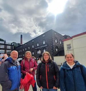 a group of people standing on a street