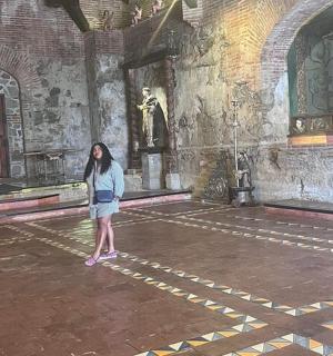 a woman standing in a room in a building