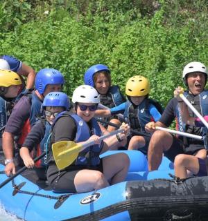a group of people are rafting on a river