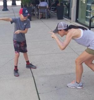 a young boy and a girl playing with a ball