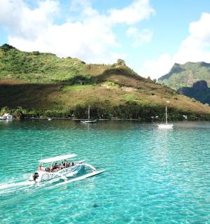 a group of people on a boat in the water