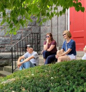 a group of people sitting on the steps