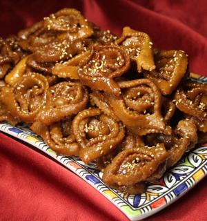 a pile of pretzels on a plate on a table