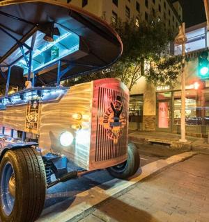 a metal car parked on the side of a street