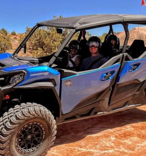 a group of people riding in a atv
