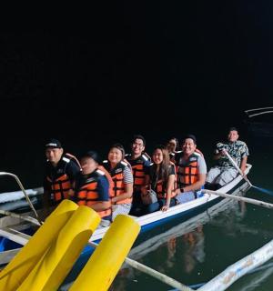 a group of people on a boat in the water