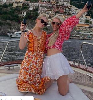 two women on a boat posing for a picture