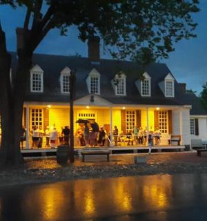 a group of people standing outside of a building
