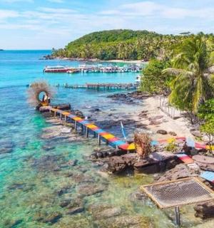 an aerial view of a beach with a pier