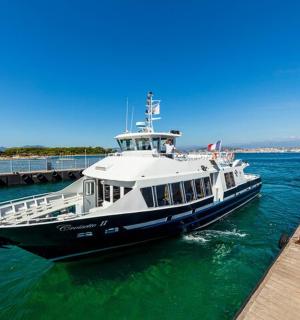 a boat in the water next to a dock