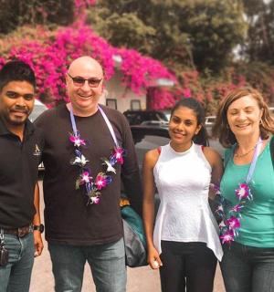 a group of three people posing for a picture