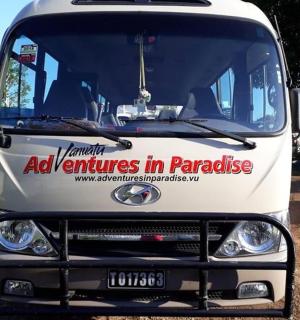 a white truck with a sign on the front of it