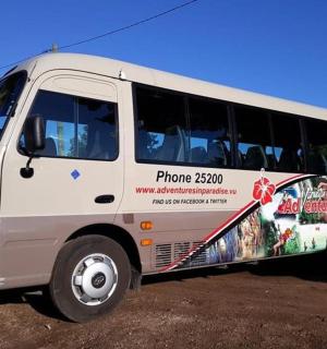 a white bus with an advertisement on the side of it