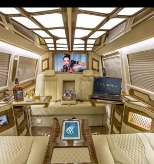 a train room with a laptop and a tv