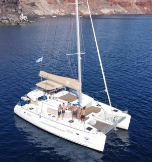a group of people on a sailboat in the water