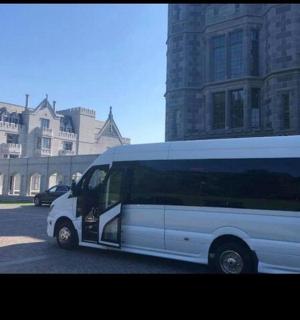 a white van parked in front of a building