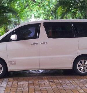 a white van is parked on a brick street