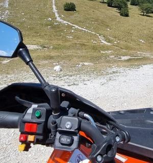 a close up of the view of a motorcycle mirror