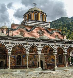 a large building with a cross on top of it