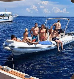 a group of people on a boat in the water