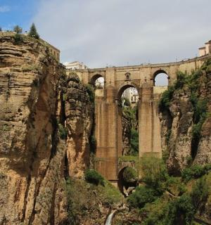 a bridge on the side of a mountain