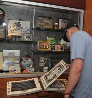 a man is looking at a display in a store