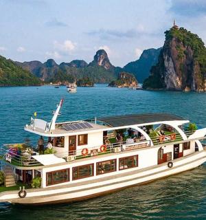 a boat on the water with mountains in the background