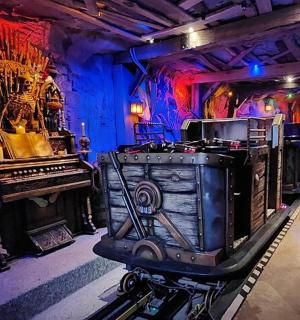 a room with a piano and a train in it