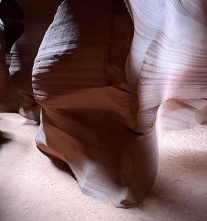 a rock wall in a canyon with