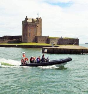 a group of people on a boat in the water