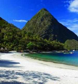 a beach with a mountain in the background