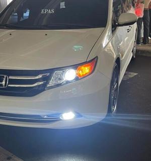 a white car parked on the side of a street