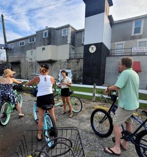 a group of people on bikes in front of a building
