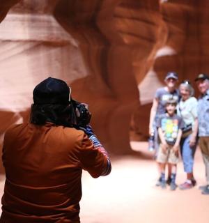 a man taking a picture of a group of people