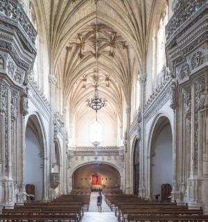 a large cathedral with a bunch of pews in it