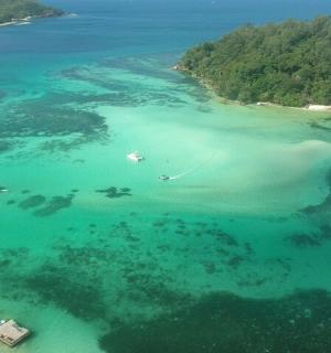 an aerial view of an island in the ocean