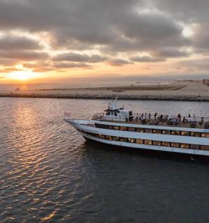 a boat in the water with a group of people on it