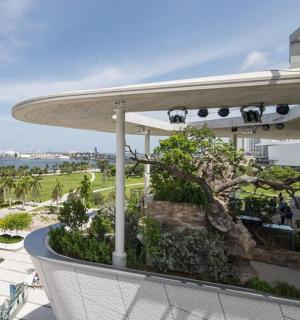 a view of the ocean from the balcony of a resort