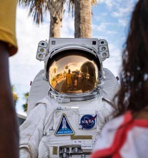 a person in an astronaut suit with a camera on his head