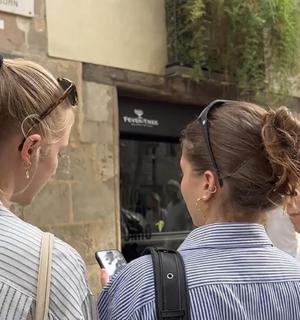 two women walking down the street