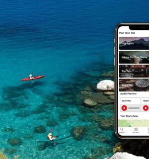 a cell phone taking a picture of a boat in the water