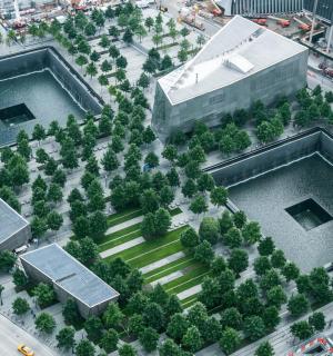 an overhead view of two large buildings with trees