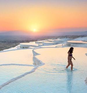 a woman walking in the blue pool at the blue lagoon